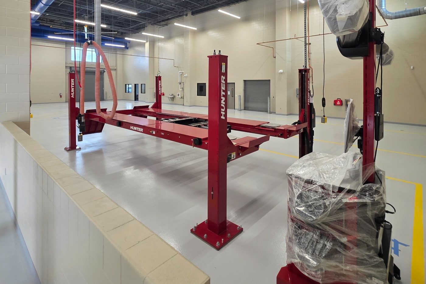 Hunter alignment lift installation in progress with equipment on site